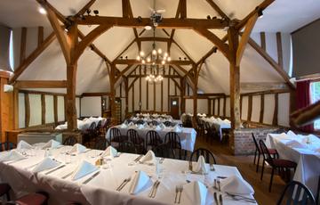 The Watermill restaurant set up for an event with places set at the tables