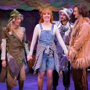 Dot stands holding hands with her friends, Scarrow, Lionel and Tinman